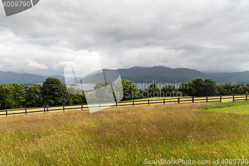 Image of view to lake and farmland at connemara in ireland