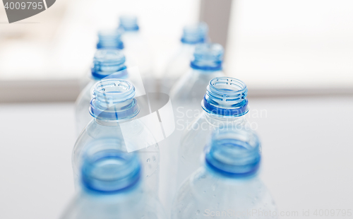 Image of close up of empty used plastic bottles on table