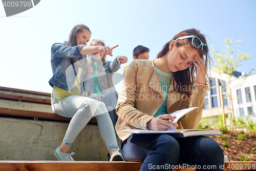 Image of student girl suffering of classmates mockery