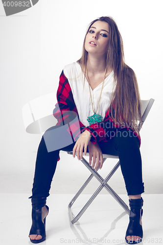 Image of fashionable young model posing with trendy clothes