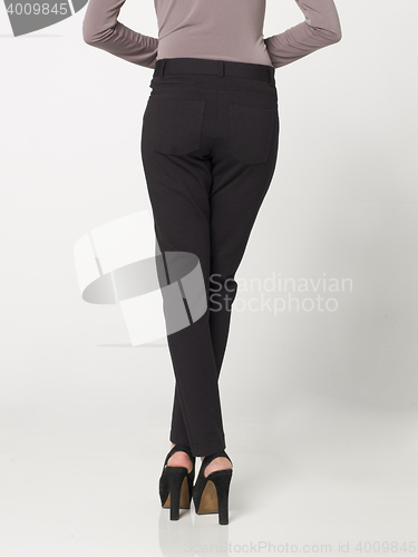 Image of fashionable youn slim woman posing in look book