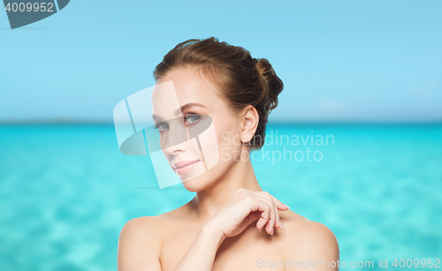 Image of beautiful young woman face over white background