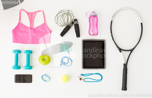 Image of tablet pc, smartphone and sports stuff