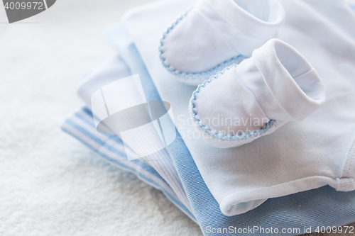 Image of close up of baby boys clothes for newborn on table