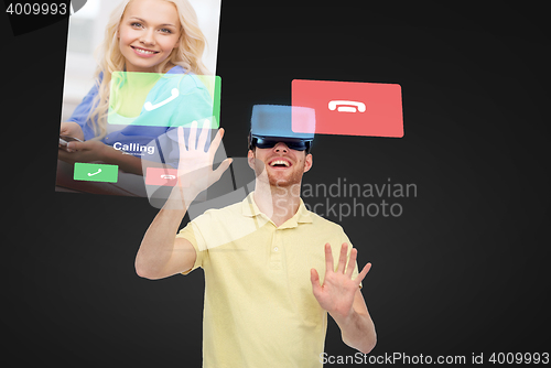 Image of happy man in virtual reality headset or 3d glasses