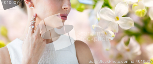 Image of close up of beautiful woman with ring and earring