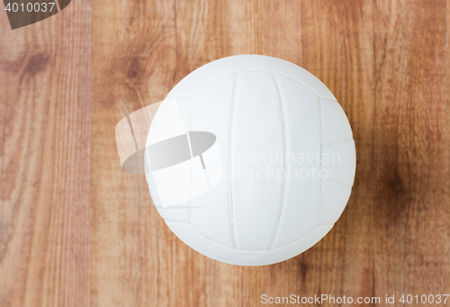 Image of close up of volleyball ball on wooden floor