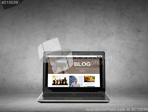 Image of laptop computer with blog web page on screen