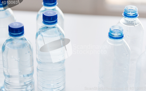 Image of close up of bottles with drinking water on table