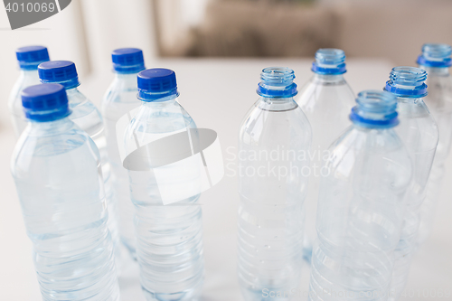 Image of close up of bottles with drinking water on table