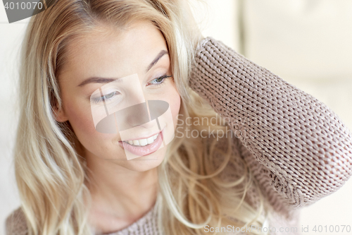 Image of happy young woman or teenage girl at home