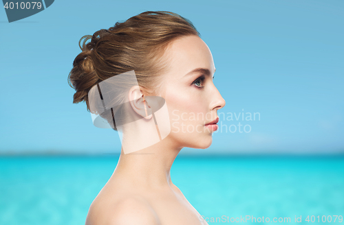 Image of beautiful young woman face over white background