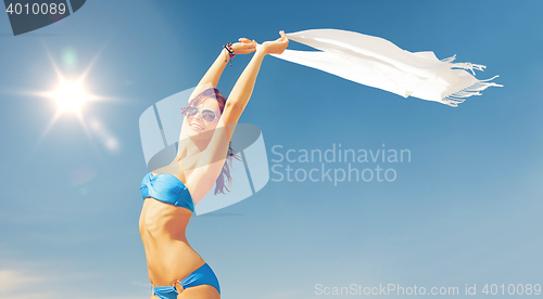 Image of woman in bikini and sunglasses