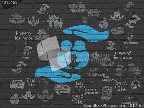 Image of Insurance concept: Family And Palm on wall background