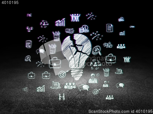 Image of Business concept: Light Bulb in grunge dark room