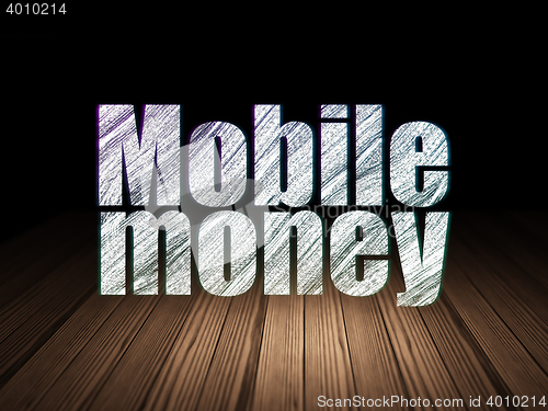 Image of Money concept: Mobile Money in grunge dark room