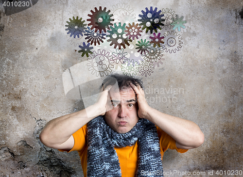 Image of Bewildered Man Releasing Thought Train of Cogs