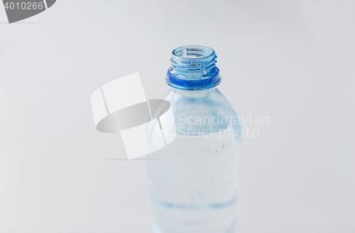 Image of close up of bottle with drinking water on table