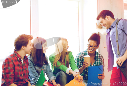 Image of students communicating and laughing at school