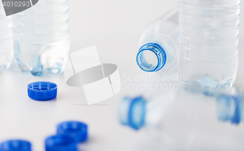 Image of close up of bottles with drinking water on table