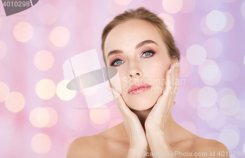 Image of beautiful young woman face and hands