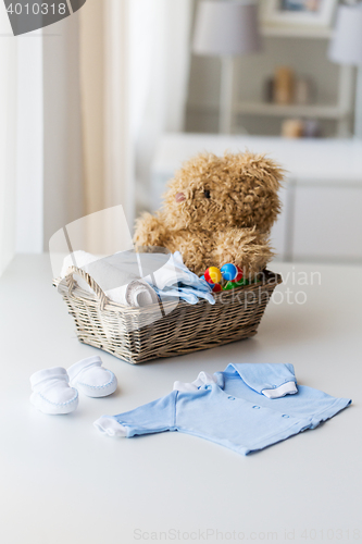 Image of close up of baby clothes and toys for newborn