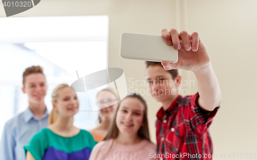 Image of group of students taking selfie with smartphone