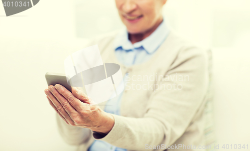 Image of close up of senior woman with smartphone texting
