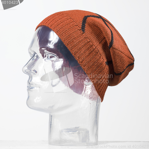 Image of orange woolen handmade cap basketball ball alike