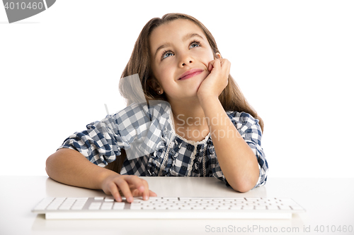 Image of Little girl working with a computer