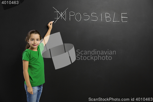 Image of Girl writing in a blackboard