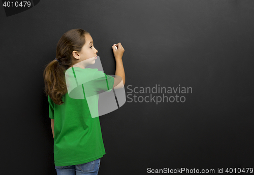 Image of Girl writing in a blackboard