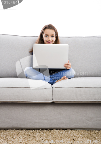 Image of Little girl working with a laptop