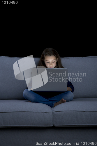 Image of Little girl working with a laptop