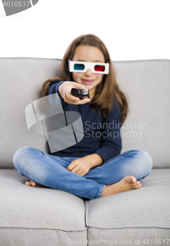 Image of Girl holding a TV remote