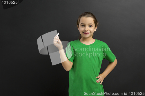 Image of Girl writing in a blackboard