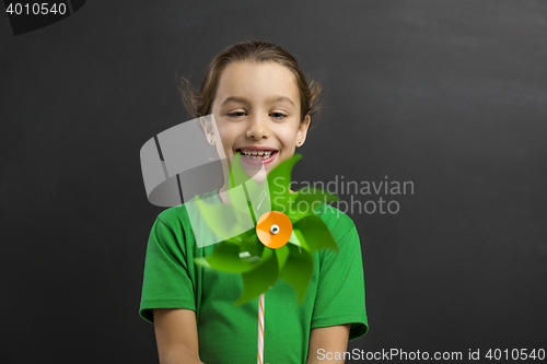 Image of Little girl holding a windmill