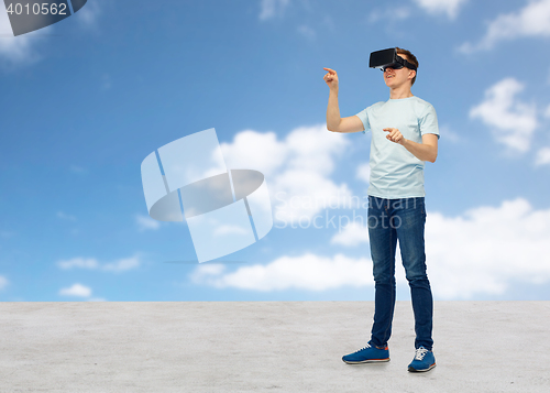 Image of happy man in virtual reality headset or 3d glasses