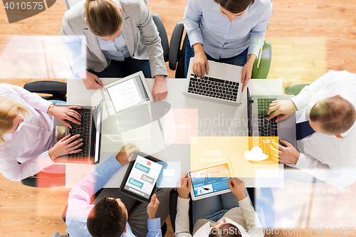 Image of business team with laptop and tablet pc computers