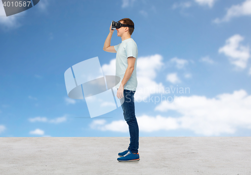 Image of happy man in virtual reality headset or 3d glasses