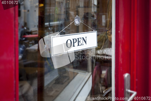 Image of an open sign at the shop door