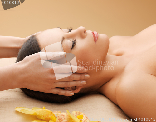 Image of beautiful woman in massage salon