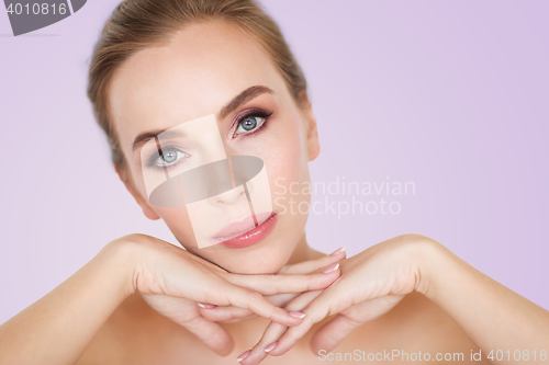 Image of beautiful young woman face and hands