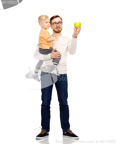 Image of happy father and little son with green apple