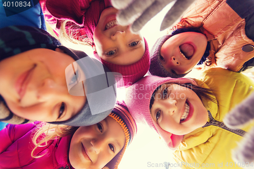Image of group of happy children faces in circle
