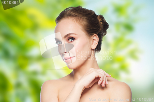 Image of beautiful young woman face over white background