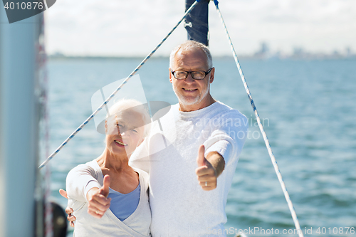 Image of senior couple sailing on sea boat or yacht