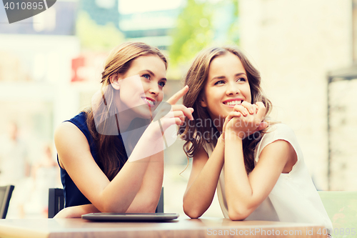 Image of happy young women or teenage girls with tablet pc