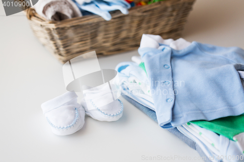 Image of close up of baby clothes for newborn boy in basket