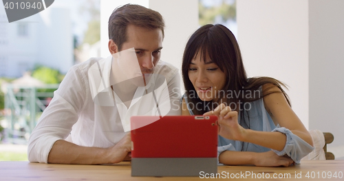 Image of Man and woman using a tablet computer together
